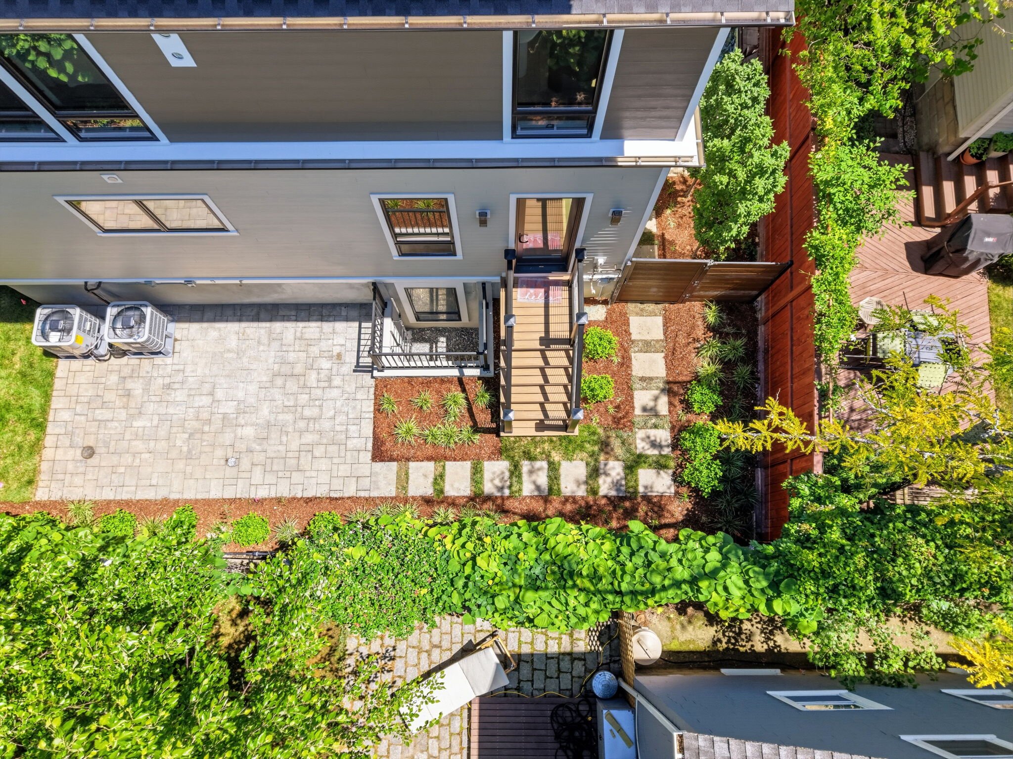 Aerial view of the backyard and rear elevation