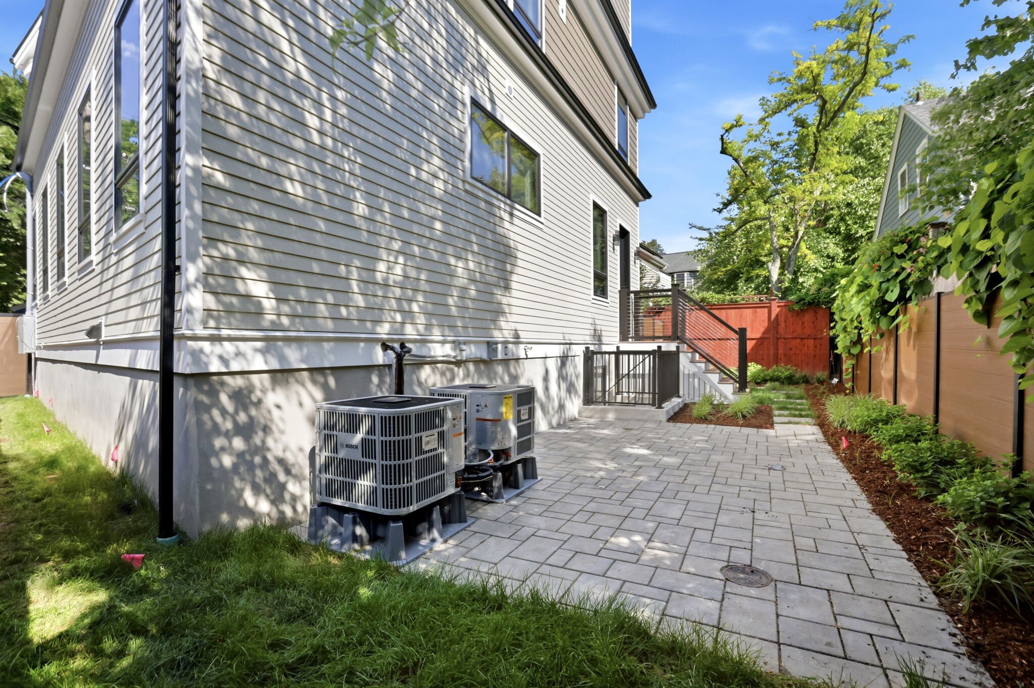 Landscaped backyard with a paver patio