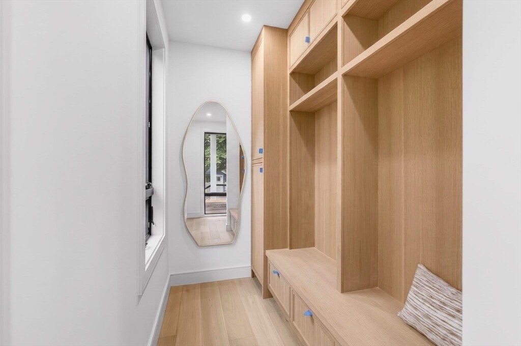 Mudroom with custom white-oak built-ins